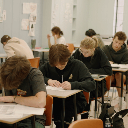 Students at Archway Academy engaged in a classroom lesson, receiving personalized academic support in a sober high school environment focused on teen recovery.